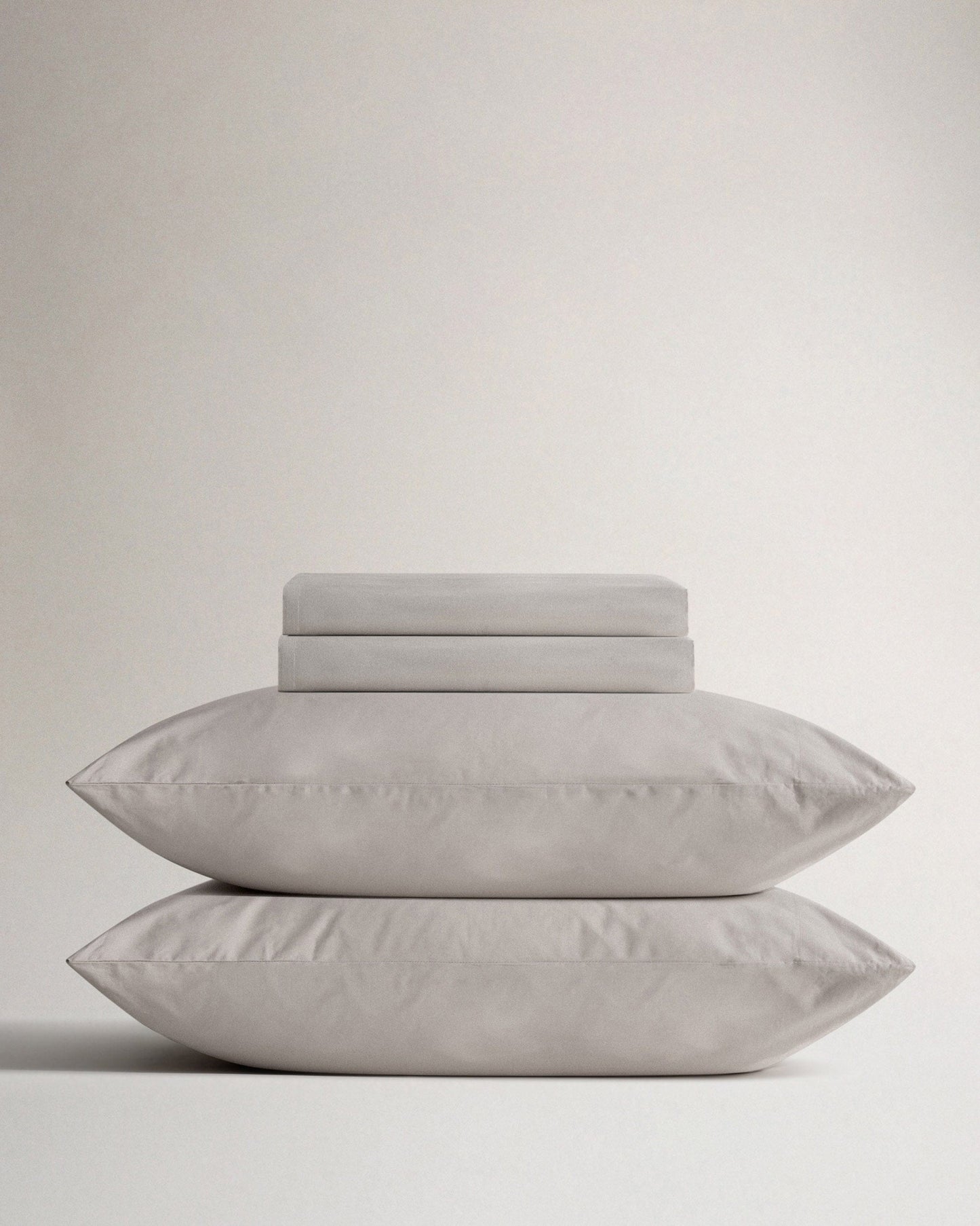 Image 1 of 4 showing Rise & Fall's Crisp & Cool organic cotton flat sheet and pillowcases in pebble.