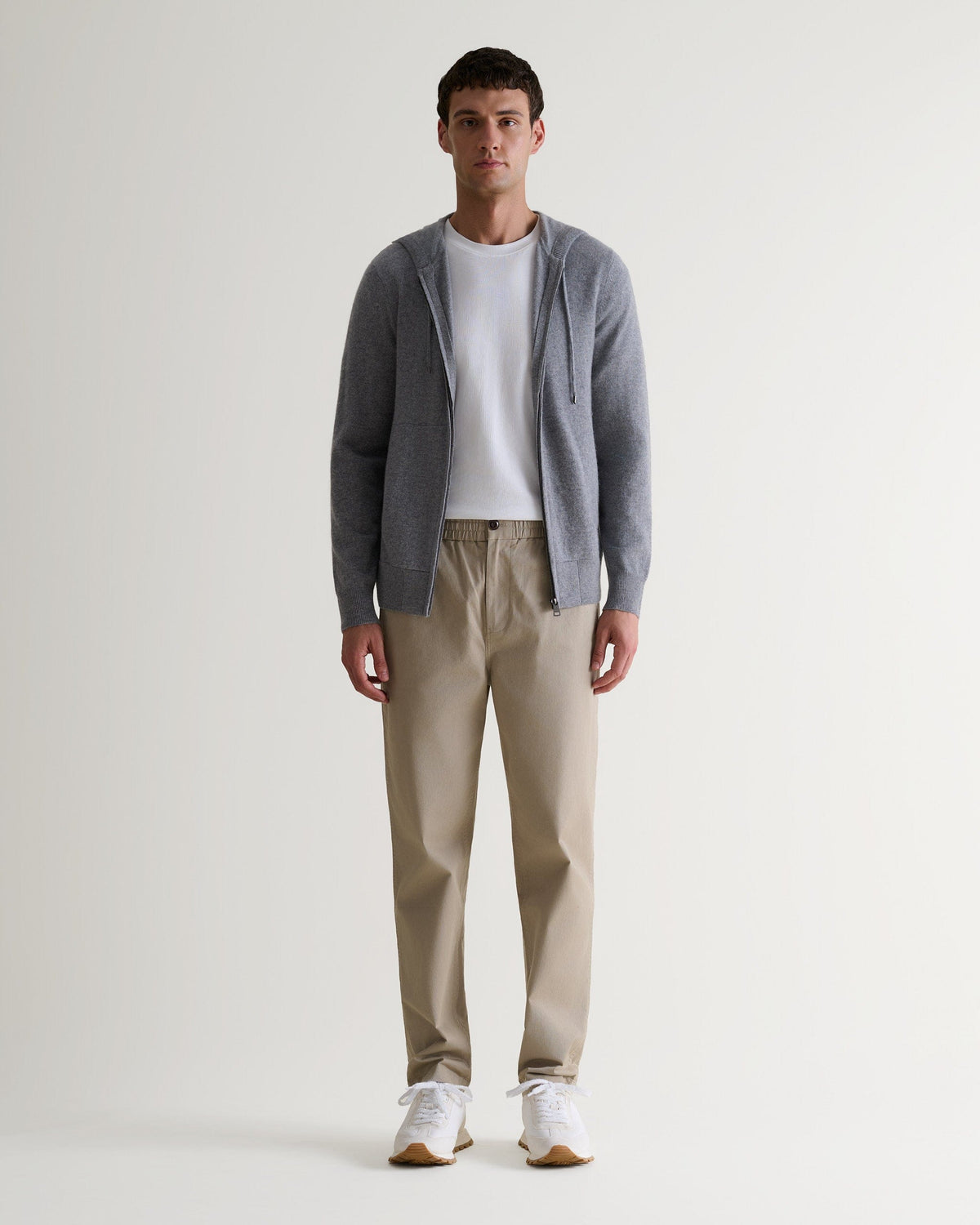 Image 1 of 6 showing man wearing Rise & Fall's fine cashmere zip hoodie, grey.