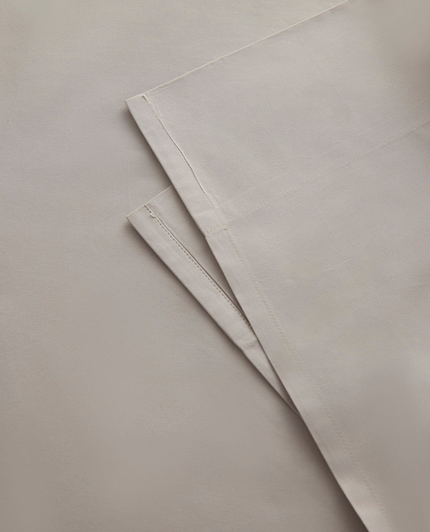 Image 2 of 3 showing Rise & Fall's Crisp & Cool organic percale cotton flat sheet in pebble.