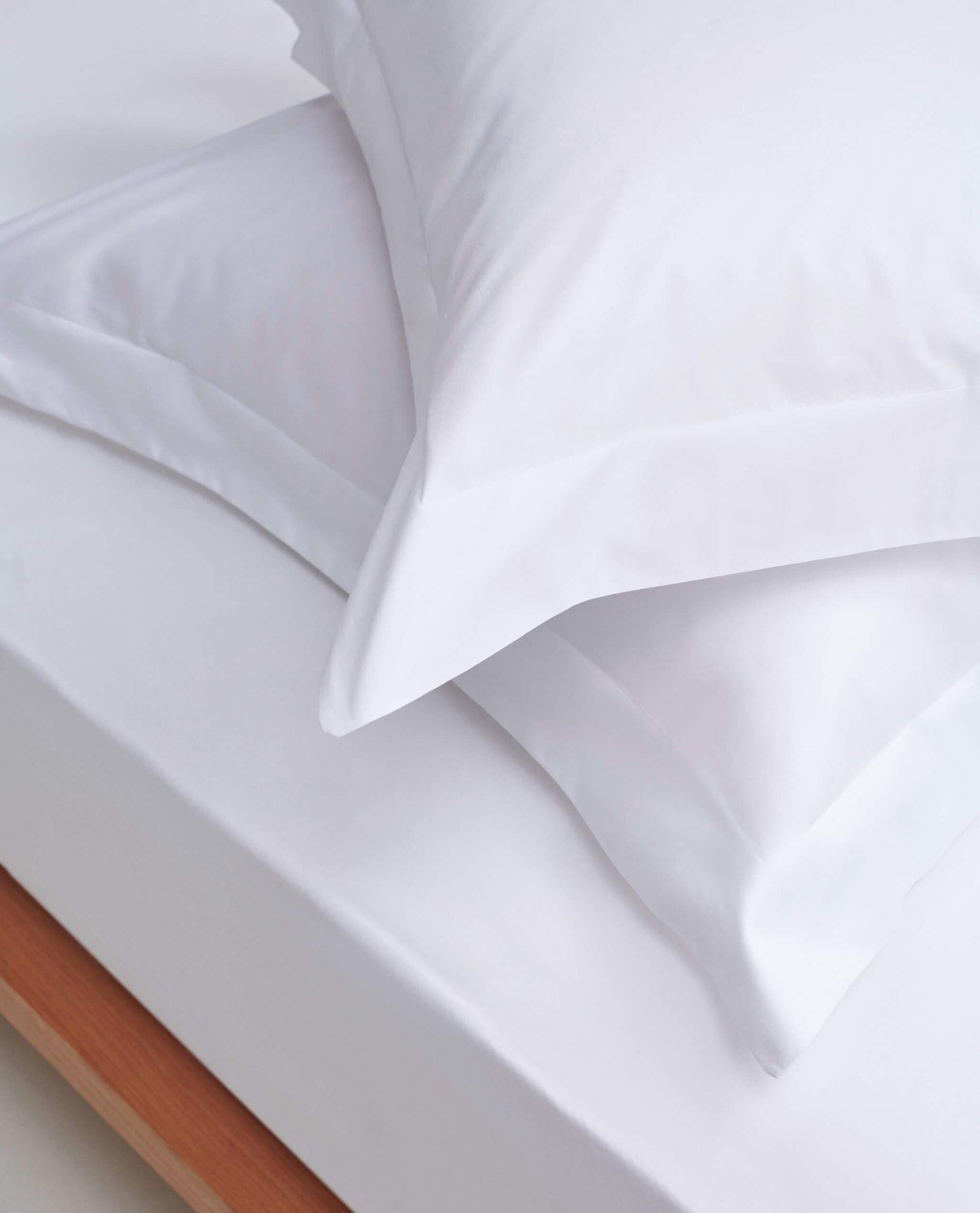 Image 2 of 4 showing Rise & Fall's Soft & Smooth Cotton Sateen Oxford Pillowcase Set in white.