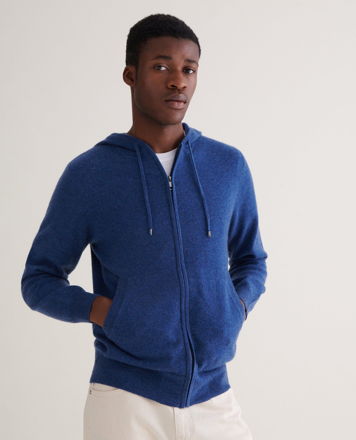 Image 3 of 3 showing man wearing Rise & Fall's Finest Cashmere Full Zip Hoodie in blue.