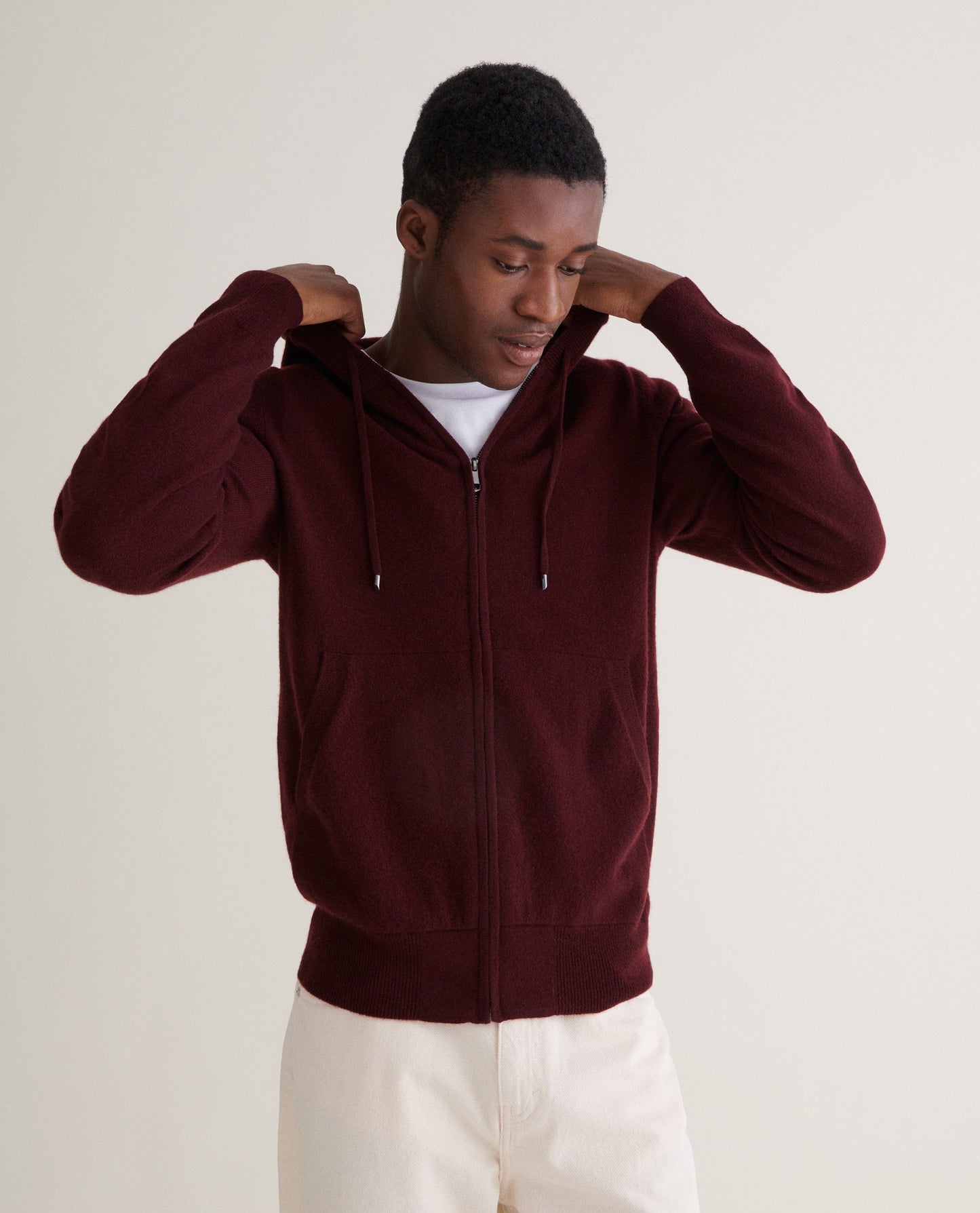 Image 3 of 4 showing man wearing Rise & Fall's Finest Cashmere Full Zip Hoodie in Oxblood.