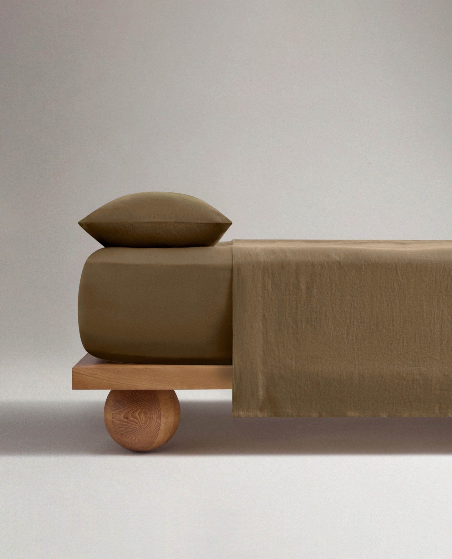 Image 3 of 4 showing Rise & Fall's Relaxed & Refined European flax™ linen fitted sheet in olive.