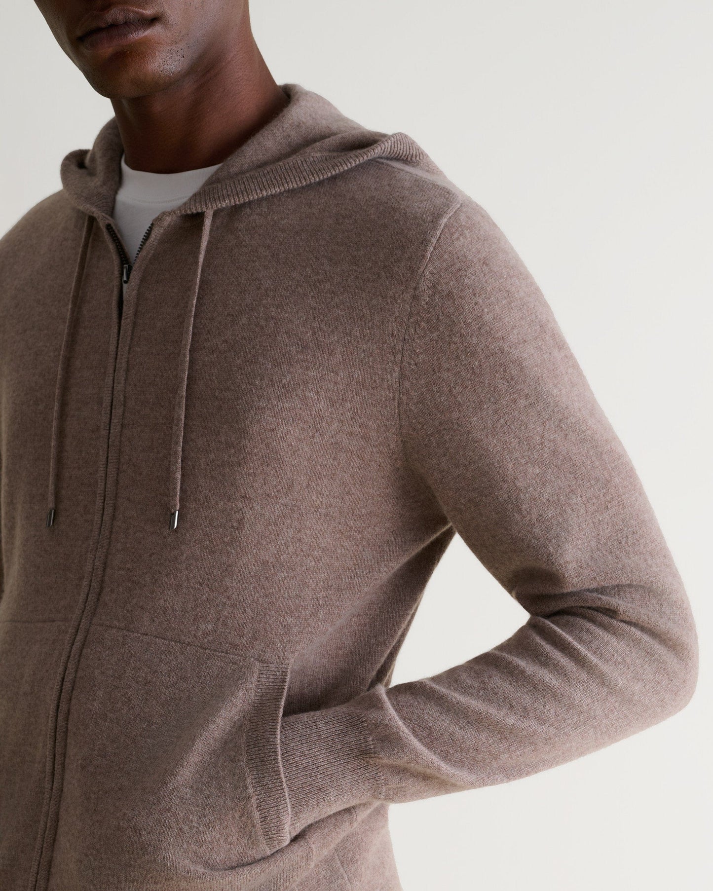 Image 4 of 5 showing man wearing Rise & Fall's fine cashmere zip hoodie, toast.