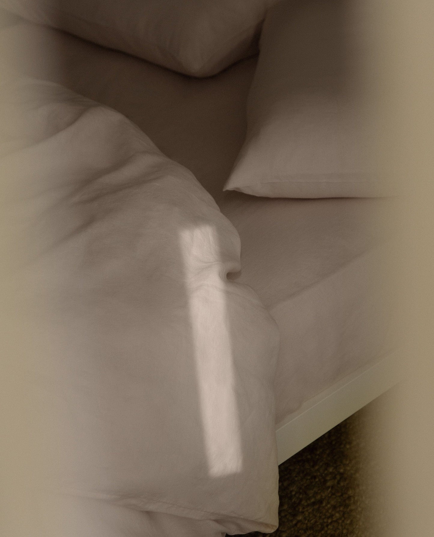 Image 4 of 6 showing Rise & Fall's House of Grey European Flax™ linen fitted sheet in peach.