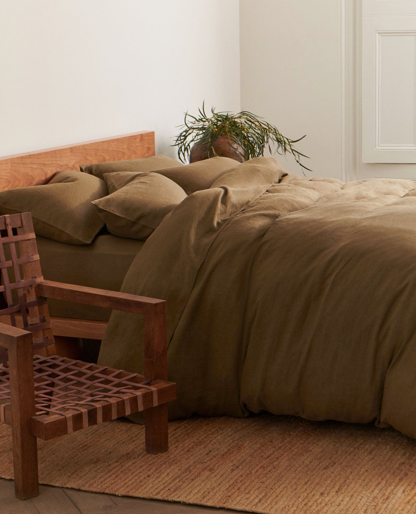 image 5 of 5 showing bed with Rise & Fall's Relaxed & Refined linen duvet set, fabric: European flax, colour: olive