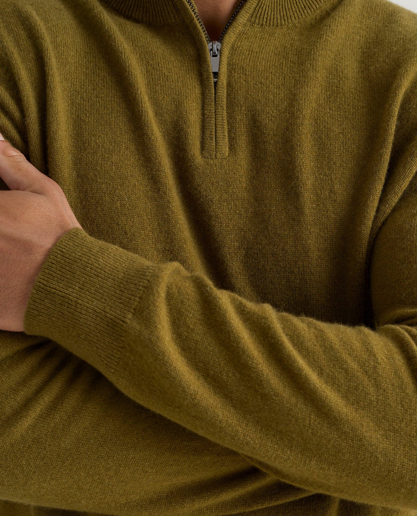 Image 5 of 5 showing man wearing Rise & Fall's fine cashmere 1/4 zip jumper, olive, close up.