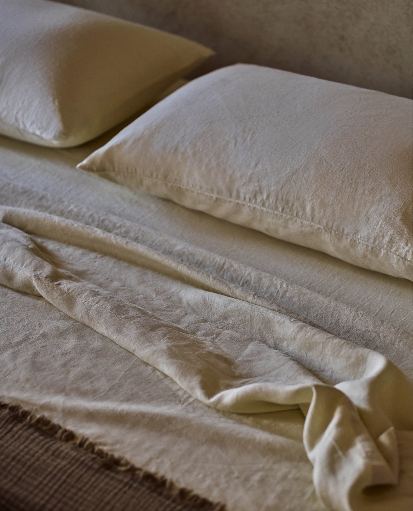Image 5 of 6 showing Rise & Fall's House of Grey European Flax™ linen fitted sheet in celery.