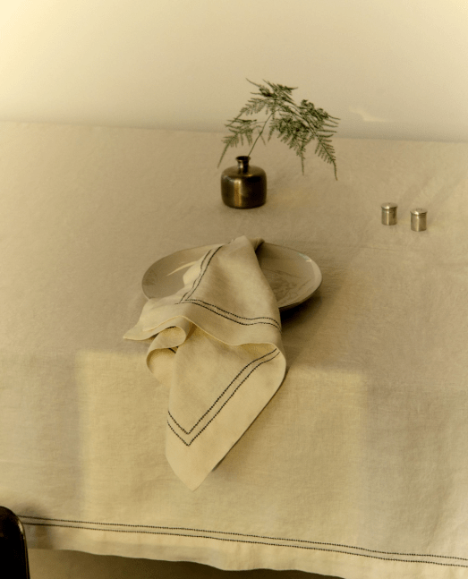Linen tablecloth and napkins on a table.