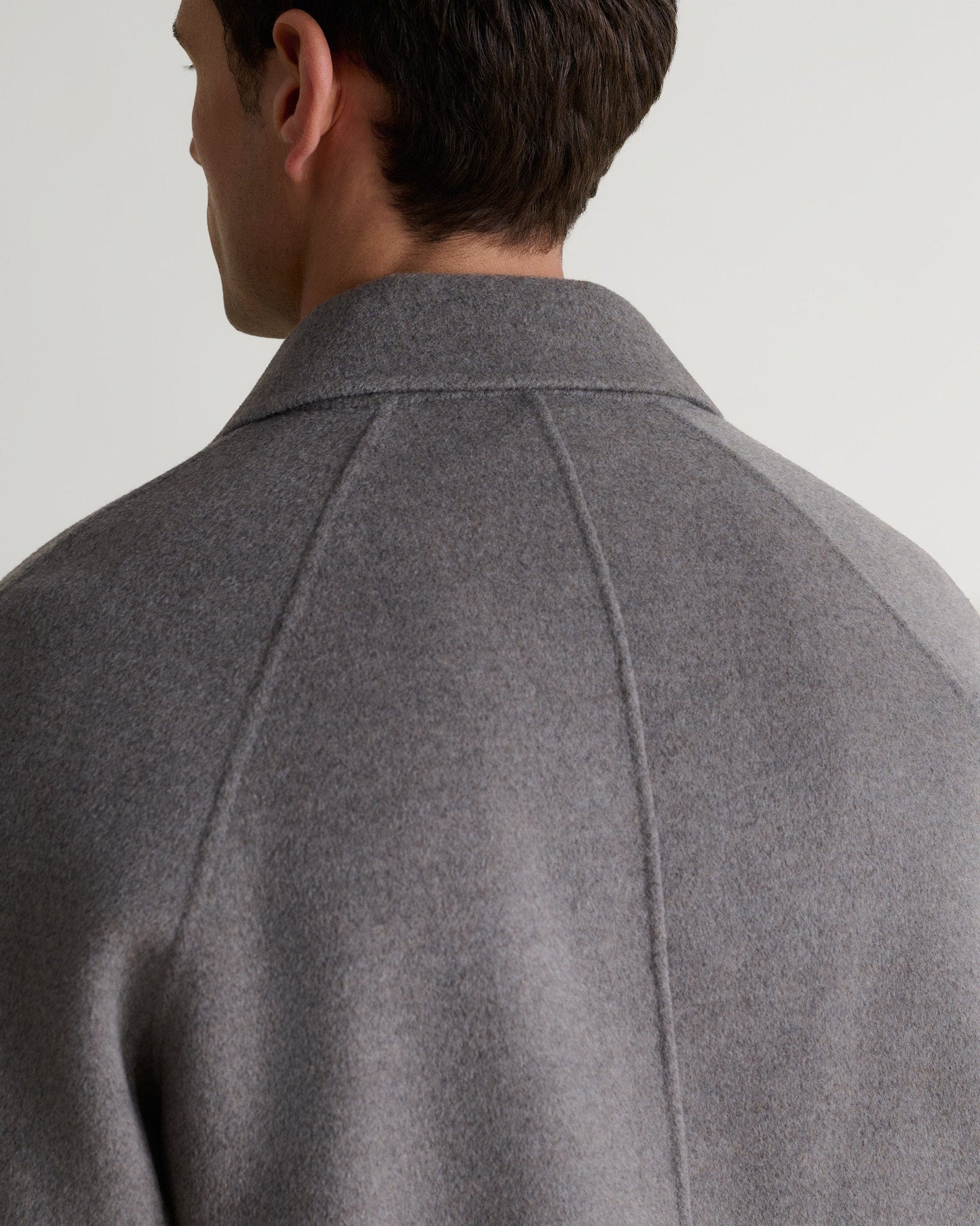 Rise & Fall's fawn coloured cashmere merino doubled-faced wool coat. A close up of back neckline.