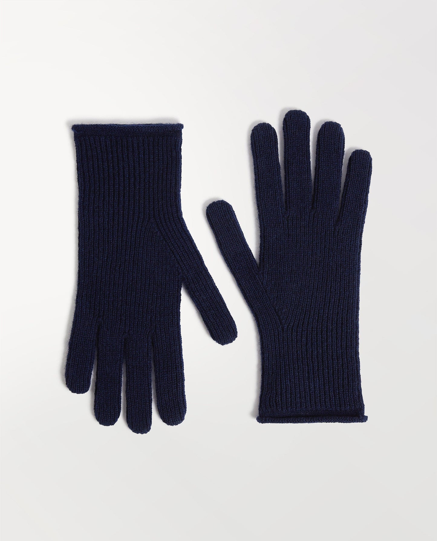 Close up of Rise & Fall's indigio cashmere merino ribbed gloves