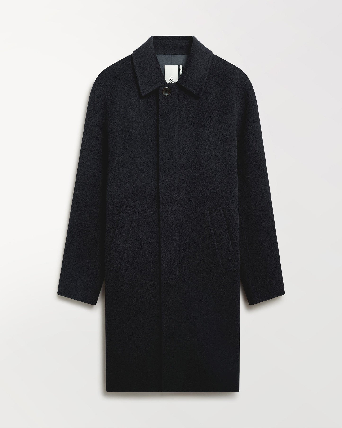 Close up of Rise & Fall's navy cashmere merino double-faced wool coat.