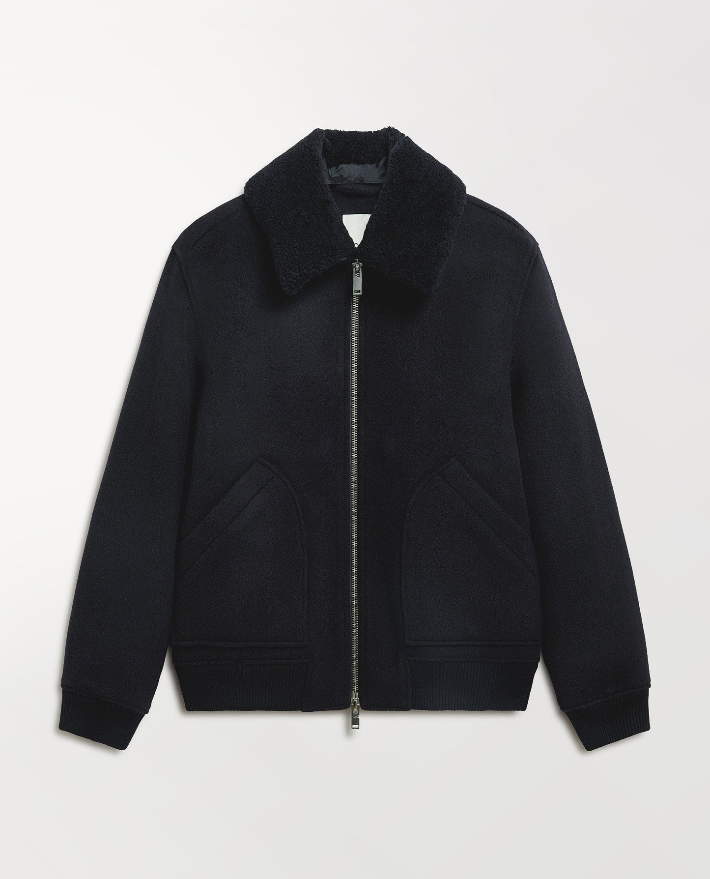 Close up Rise & Fall's navy wool bomber jacket with shearling collar.