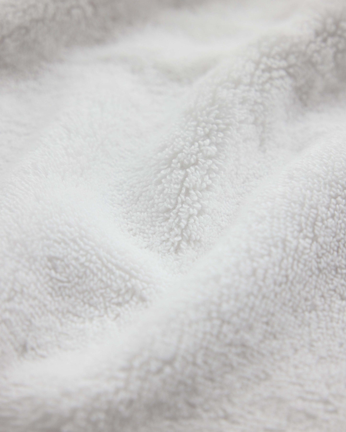 Close up of Rise & Fall's white Turkish Aegean cotton towel