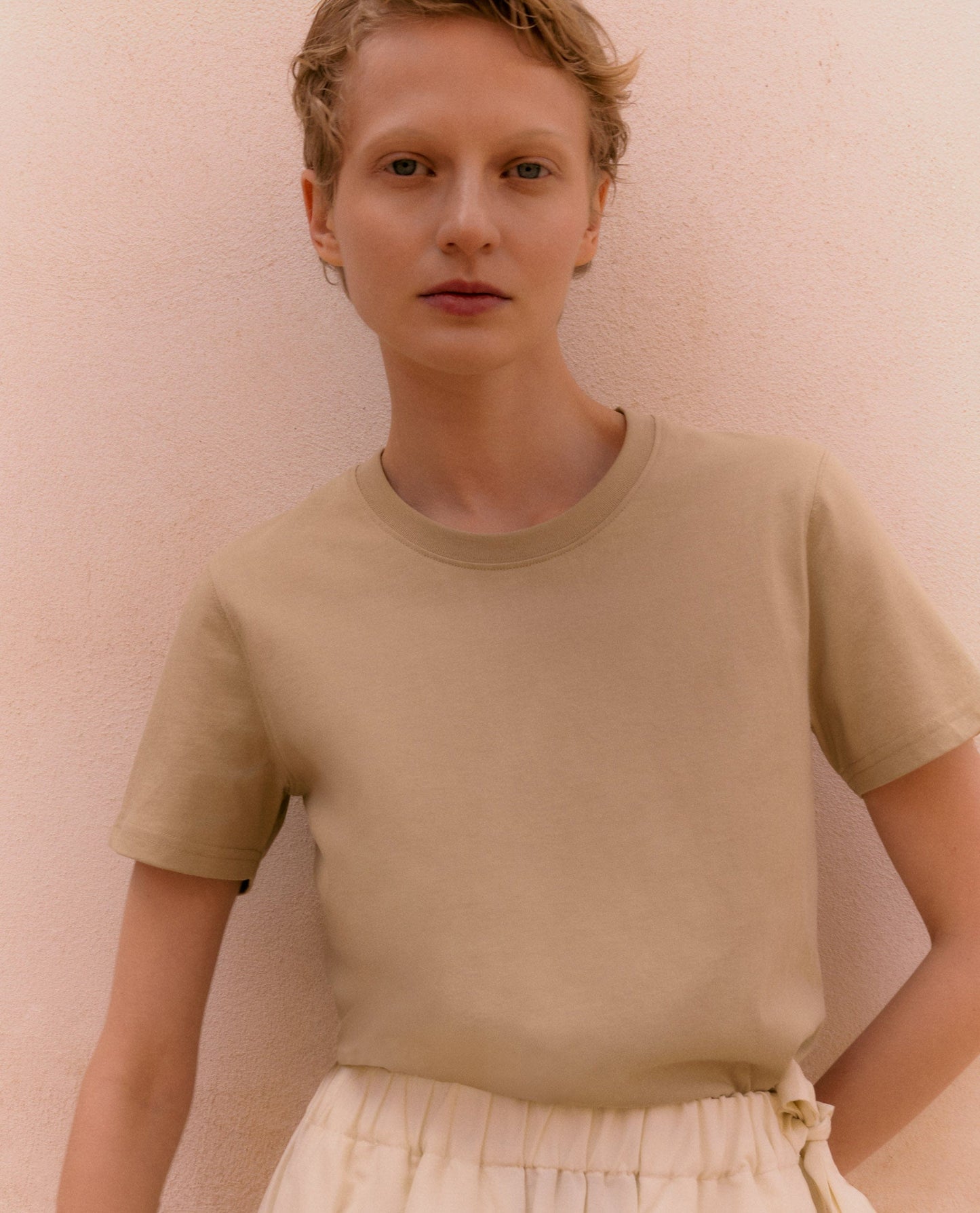 Woman wears classic 100% cotton t-shirt in smoky olive.