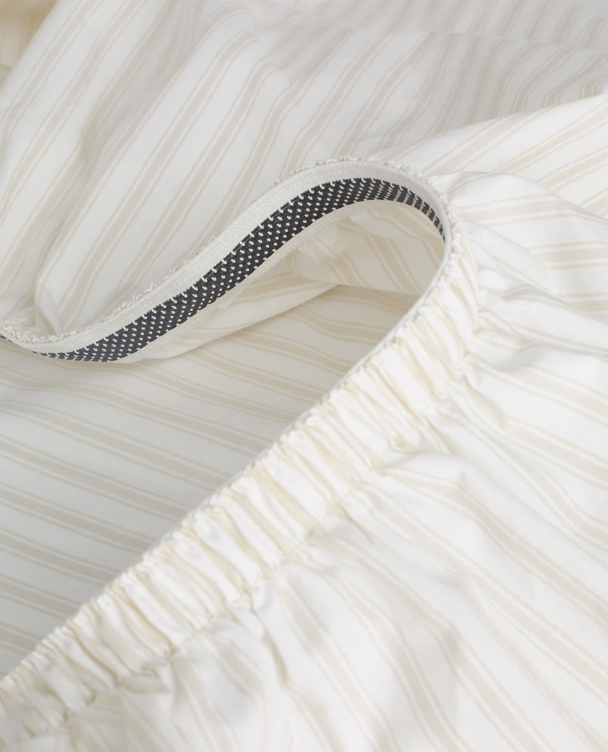 Buttermilk Stripe cotton fitted sheet with elasticated corners.