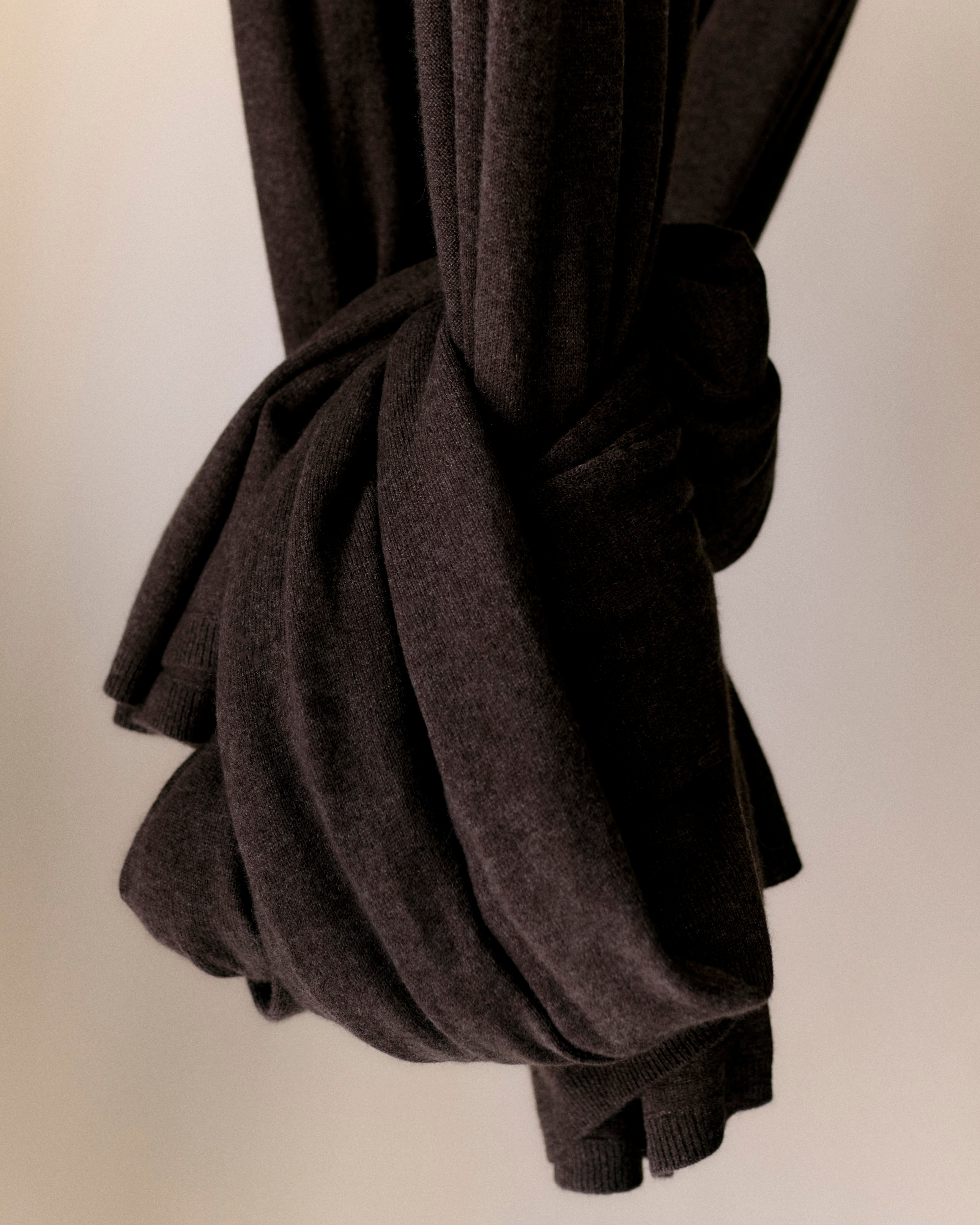 End of cashmere scarf wrapped into a ball.