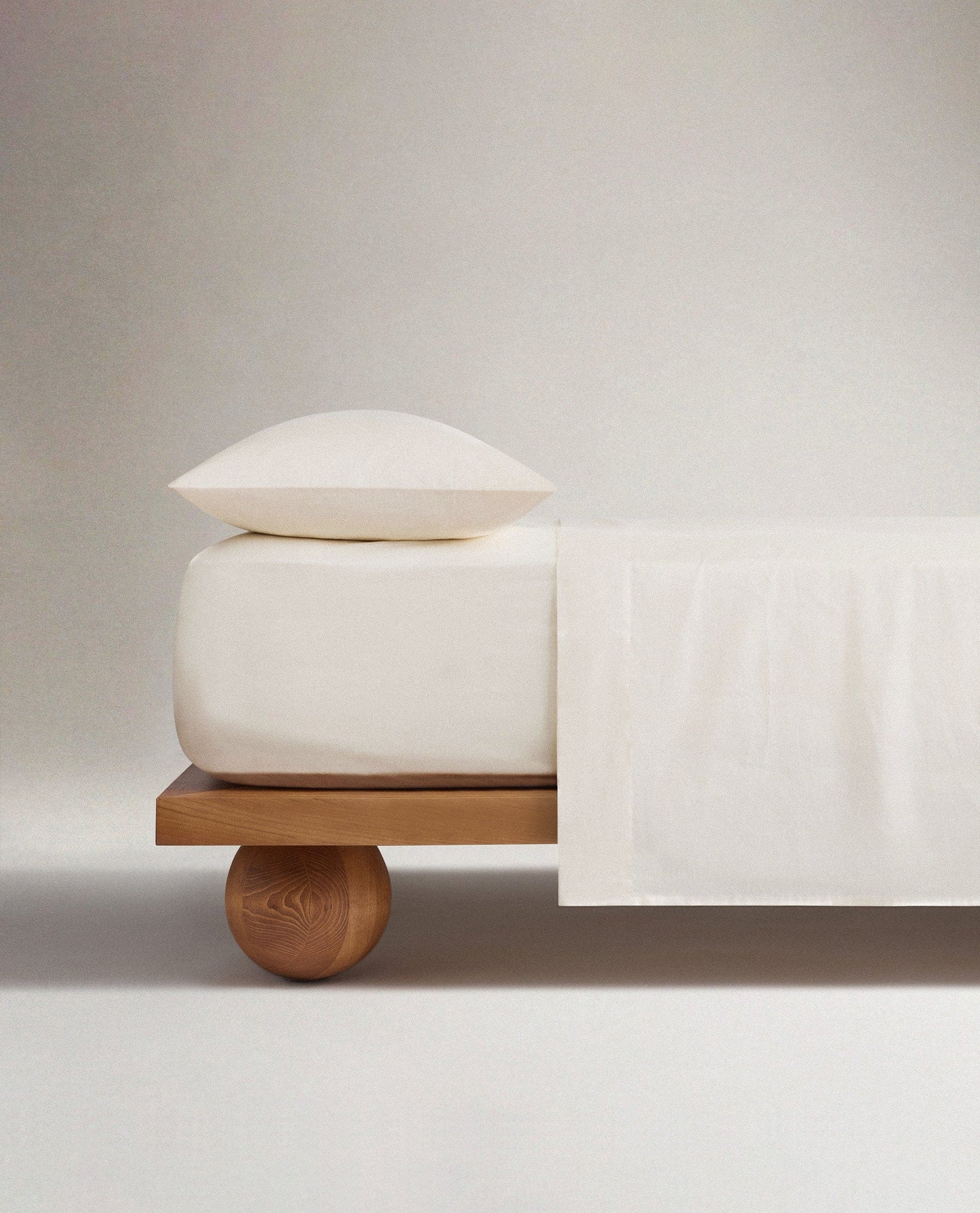 Image 1 of 3 showing Rise & Fall's Crisp & Cool organic percale cotton flat sheet in buttermilk.