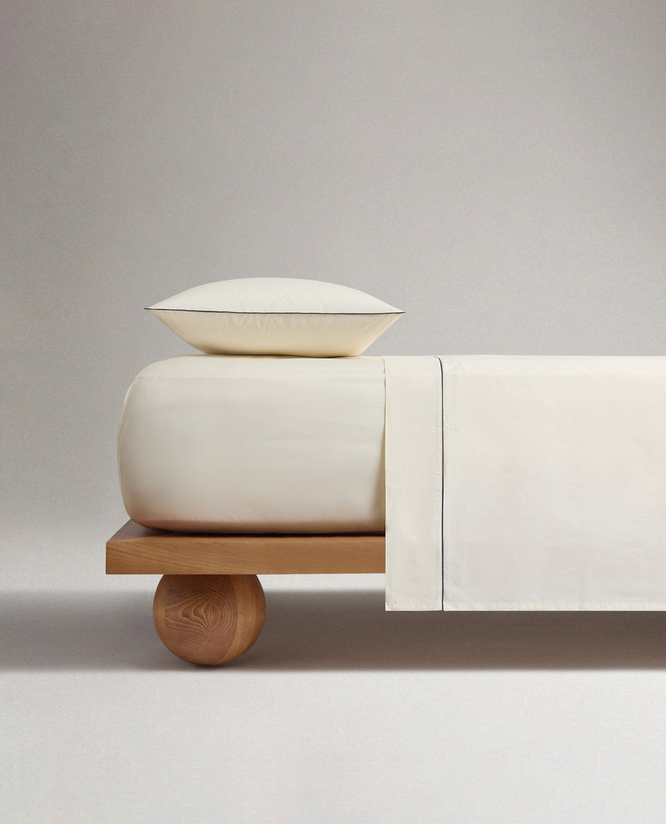 The Crisp & Cool Organic Luxury Flat Sheet - Buttermilk Black Piping