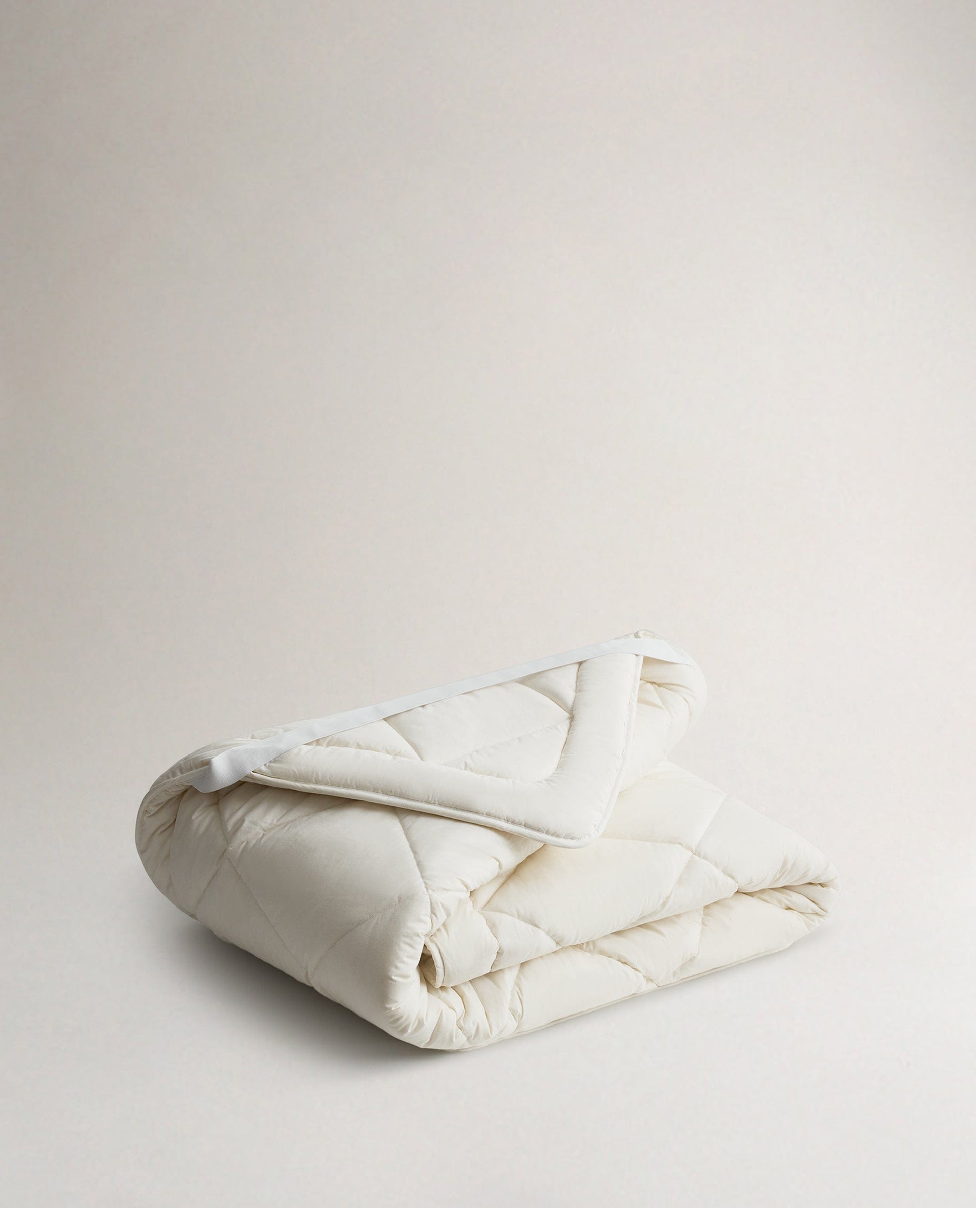 Image 1 of 2 showing Rise & Fall's  certified British Wool Mattress Topper.