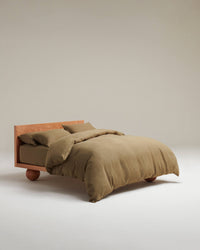 image 1 of 3 showing bed with Rise & Fall's Relaxed & Refined linen duvet set, fabric: European flax, colour: olive