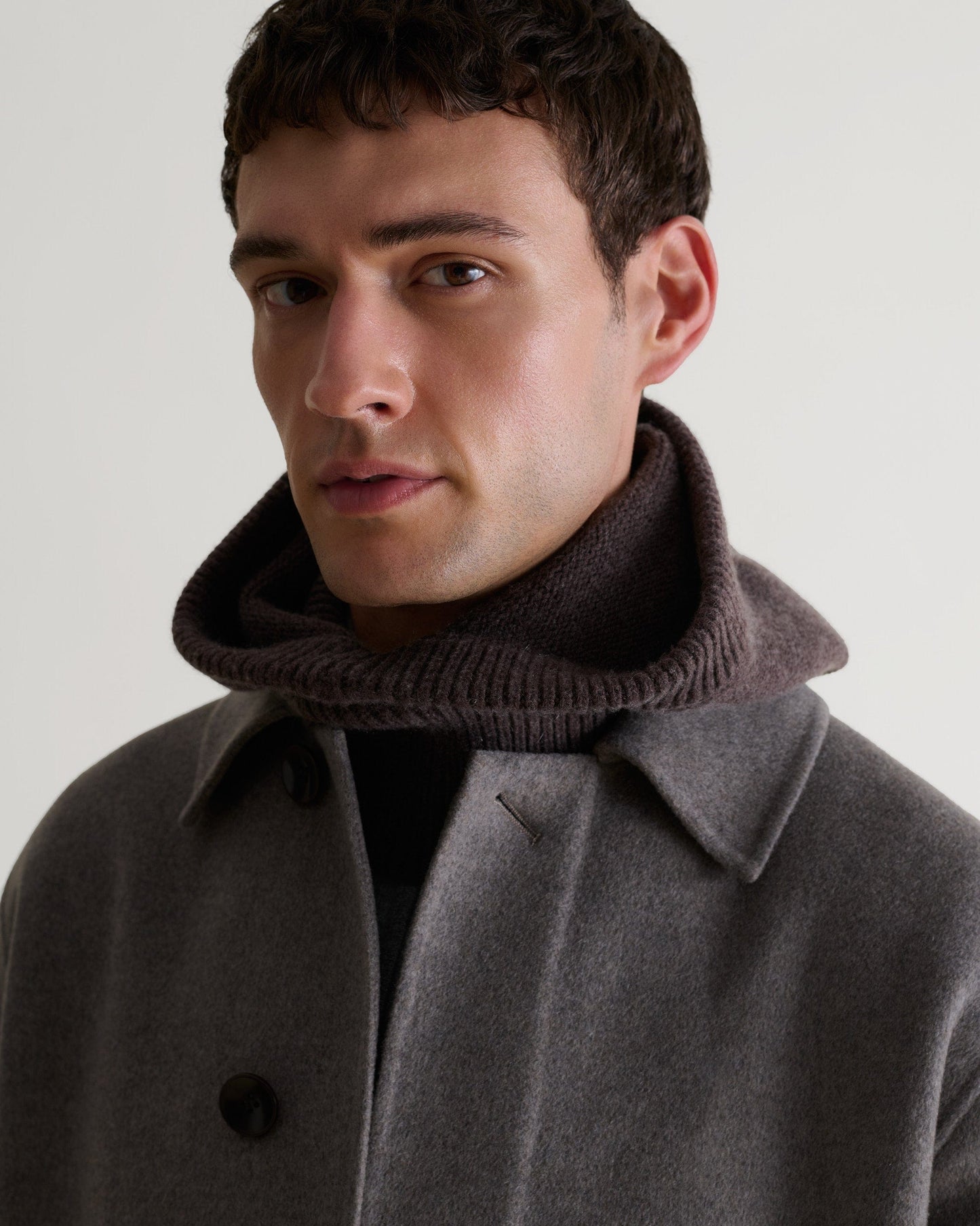 Image 1 of 3 showing man wearing Rise & Fall's chocolate brown Cashmere Merino Knitted Hood.