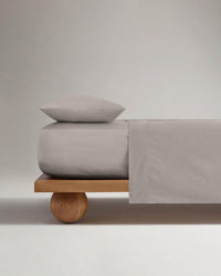 Image 1 of 3 showing Rise & Fall's Crisp & Cool organic percale cotton flat sheet in pebble.