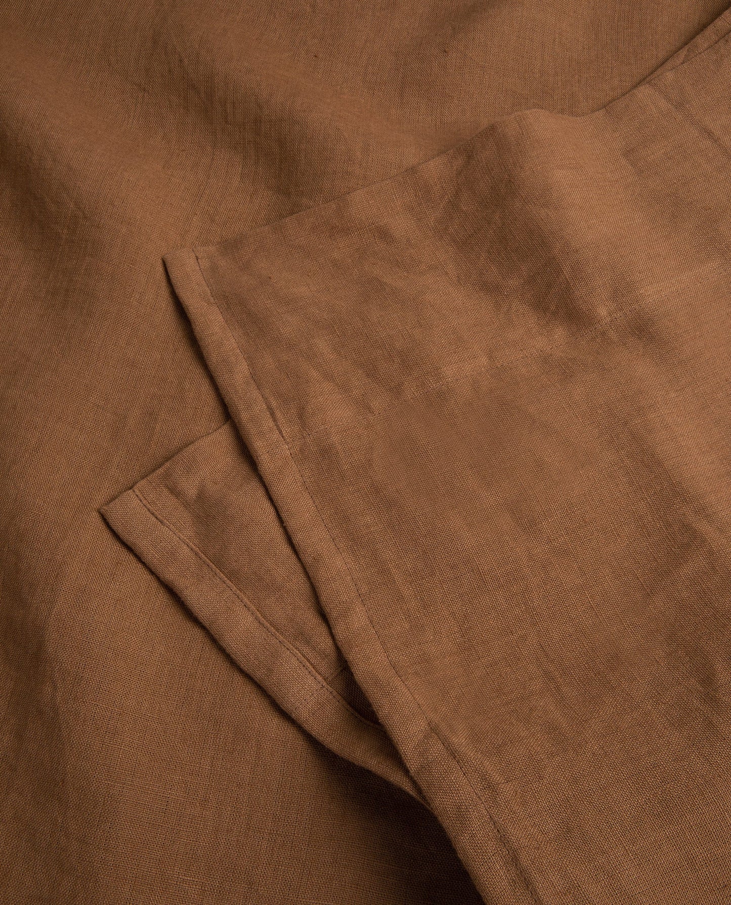 Image 3 of 3 showing Rise & Fall's Relaxed & Refined linen flat sheet in ochre.