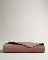 Image 1 of 3 showing Rise & Fall's sateen cotton duvet cover, colour: deep clay.