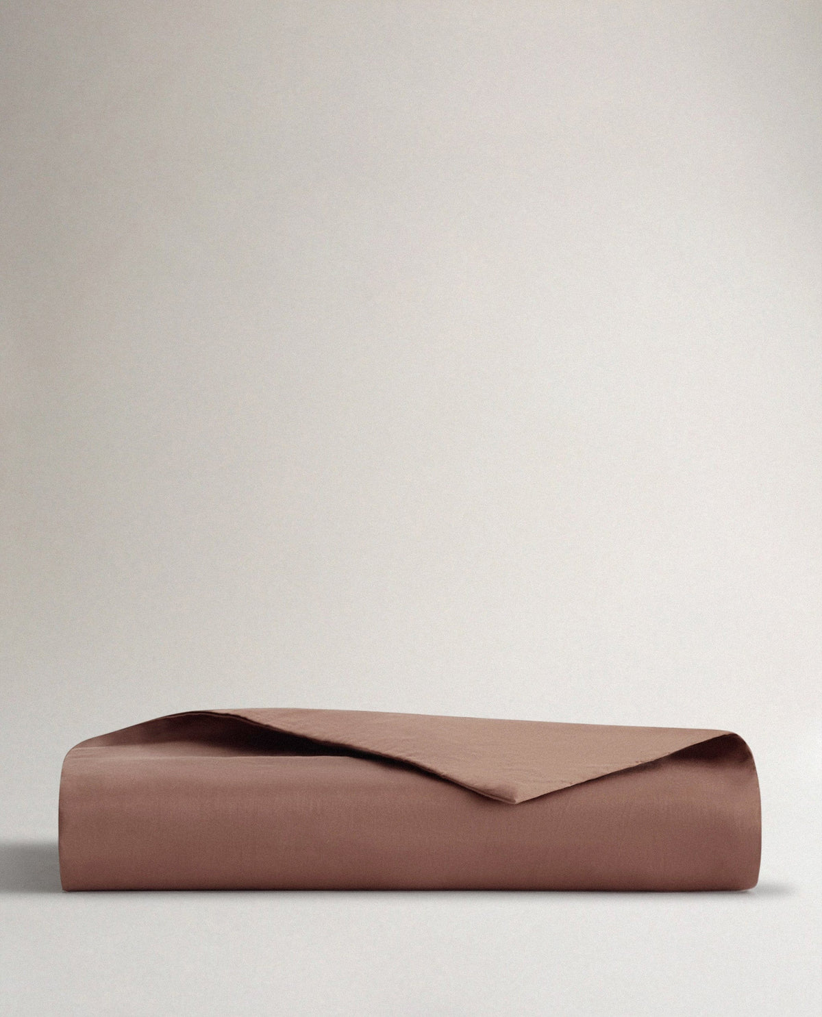 Image 1 of 3 showing Rise & Fall's sateen cotton duvet cover, colour: deep clay.