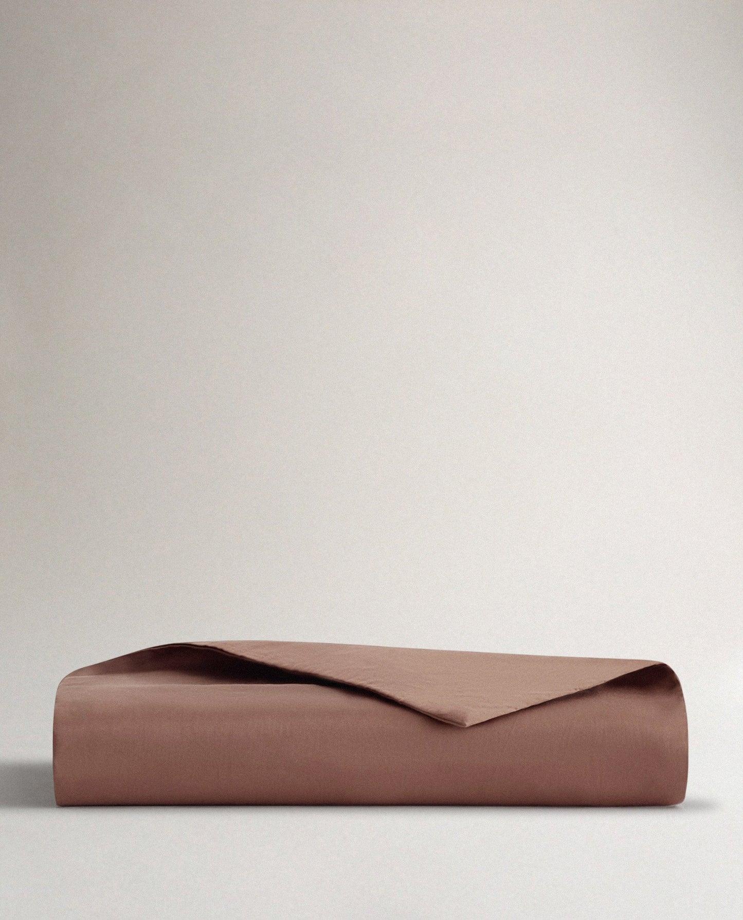 Image 1 of 3 showing Rise & Fall's sateen cotton duvet cover, colour: deep clay.