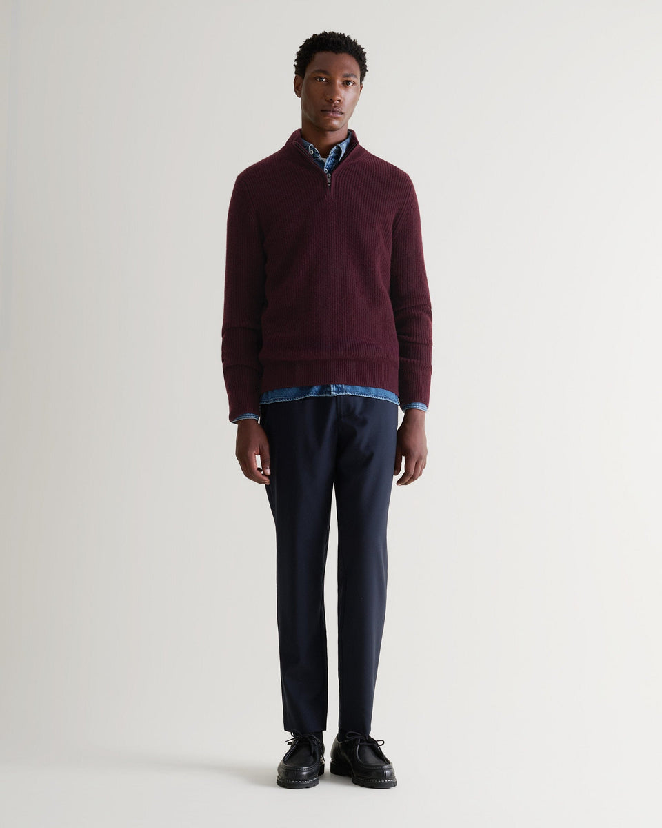 Image 1 of 4 showing man wearing Rise & Fall's Cashmere Merino Fishermans Rib 1/4 Zip Jumper in oxblood.