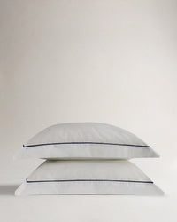 Image 1 of 4 showing Rise & Fall's Crisp & Cool Organic Cotton Oxford Pillowcase Set, colour: white navy piping.