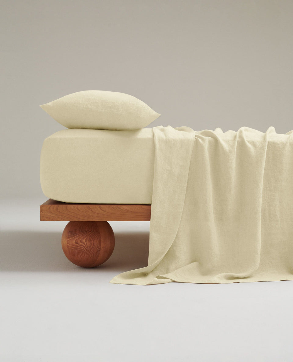 Image 1 of 4 showing Rise & Fall's House of Grey linen flat bed sheet in celery.
