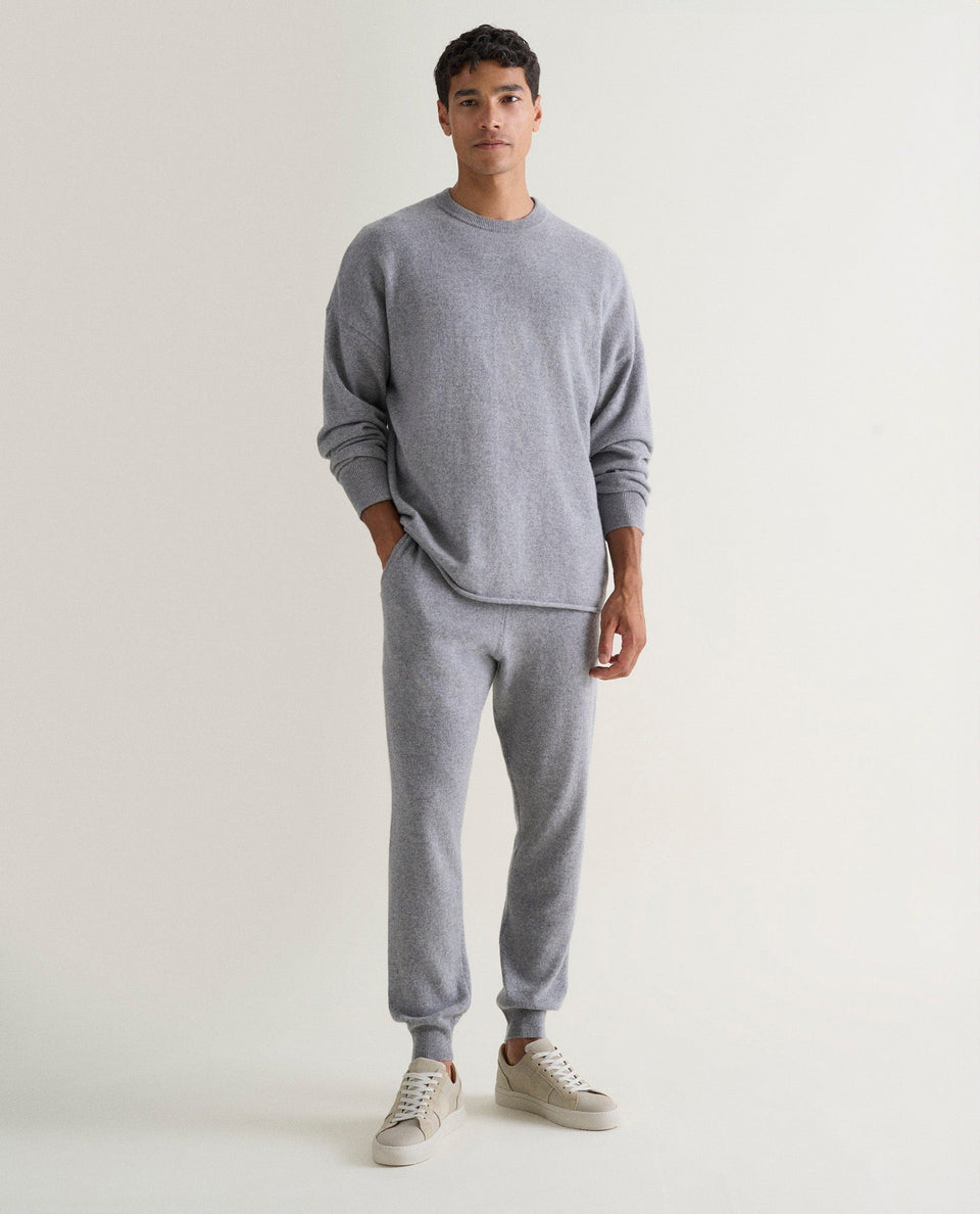 Image 1 of 5 showing man wearing Rise & Fall's finest cashmere sweatshirt in grey with matching joggers.