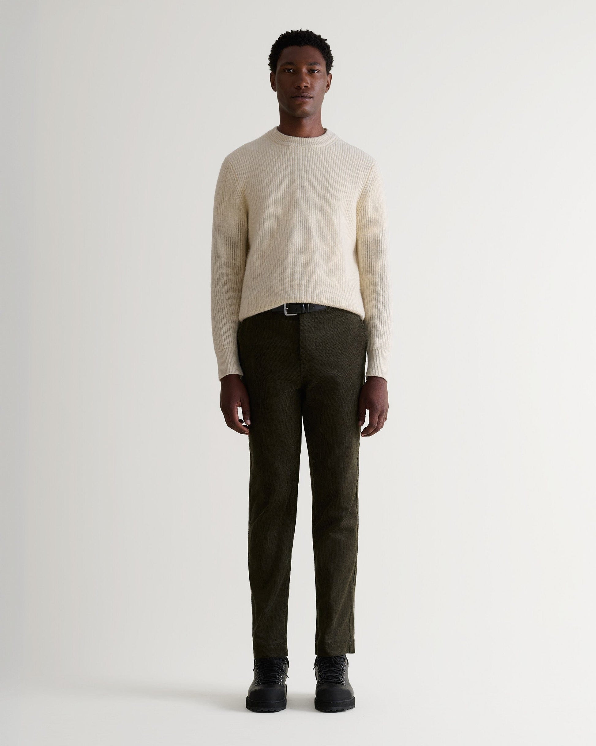 Image 1 of 5 showing man wearing Rise & Fall's Cashmere Merino Fishermans Rib Crew Neck Jumper in cream.