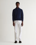 Image 1 of 5 showing man wearing Rise & Fall's fine cashmere 1/4 zip jumper, navy.