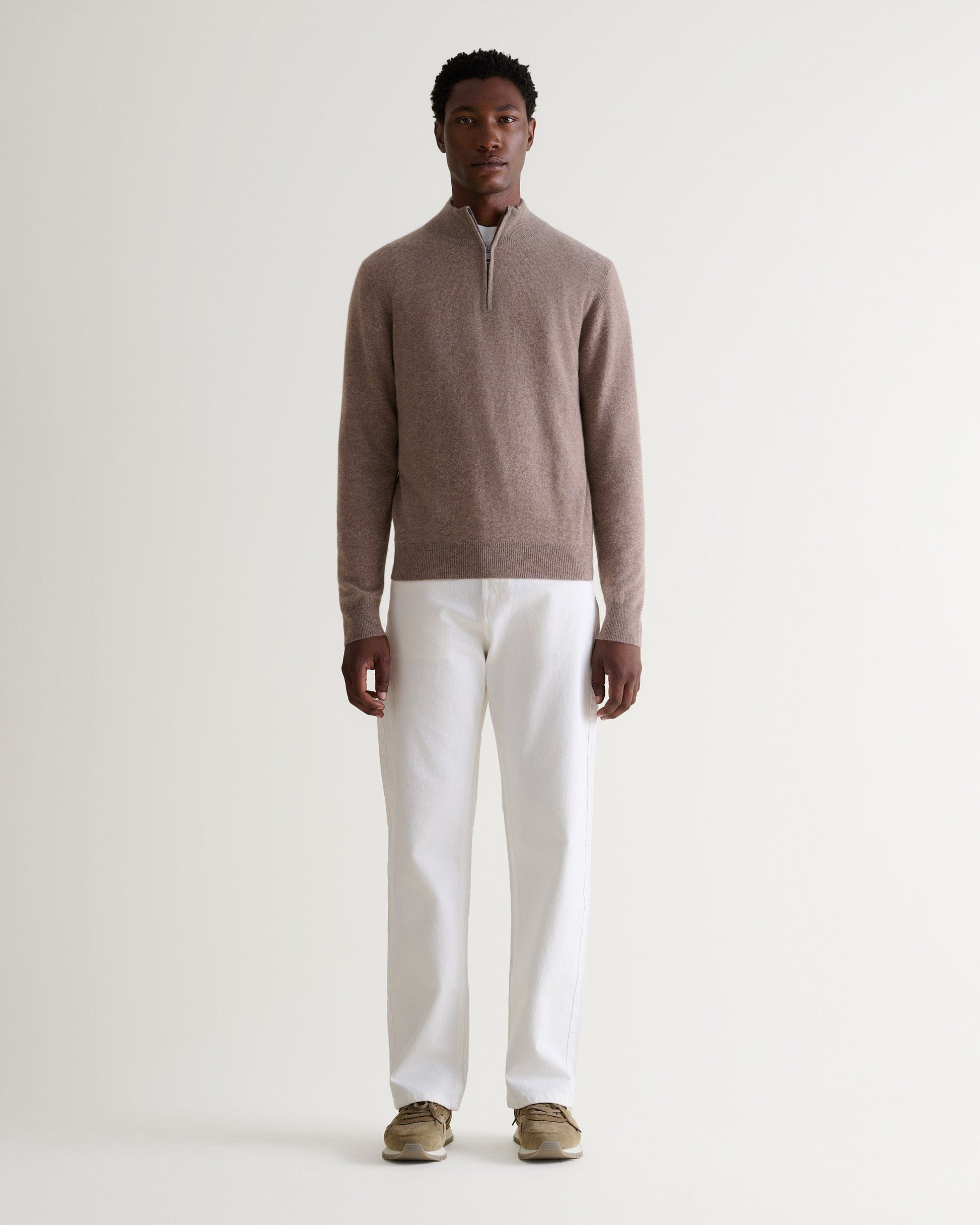 Image 1 of 5 showing man wearing Rise & Fall's fine cashmere 1/4 zip jumper, toast.