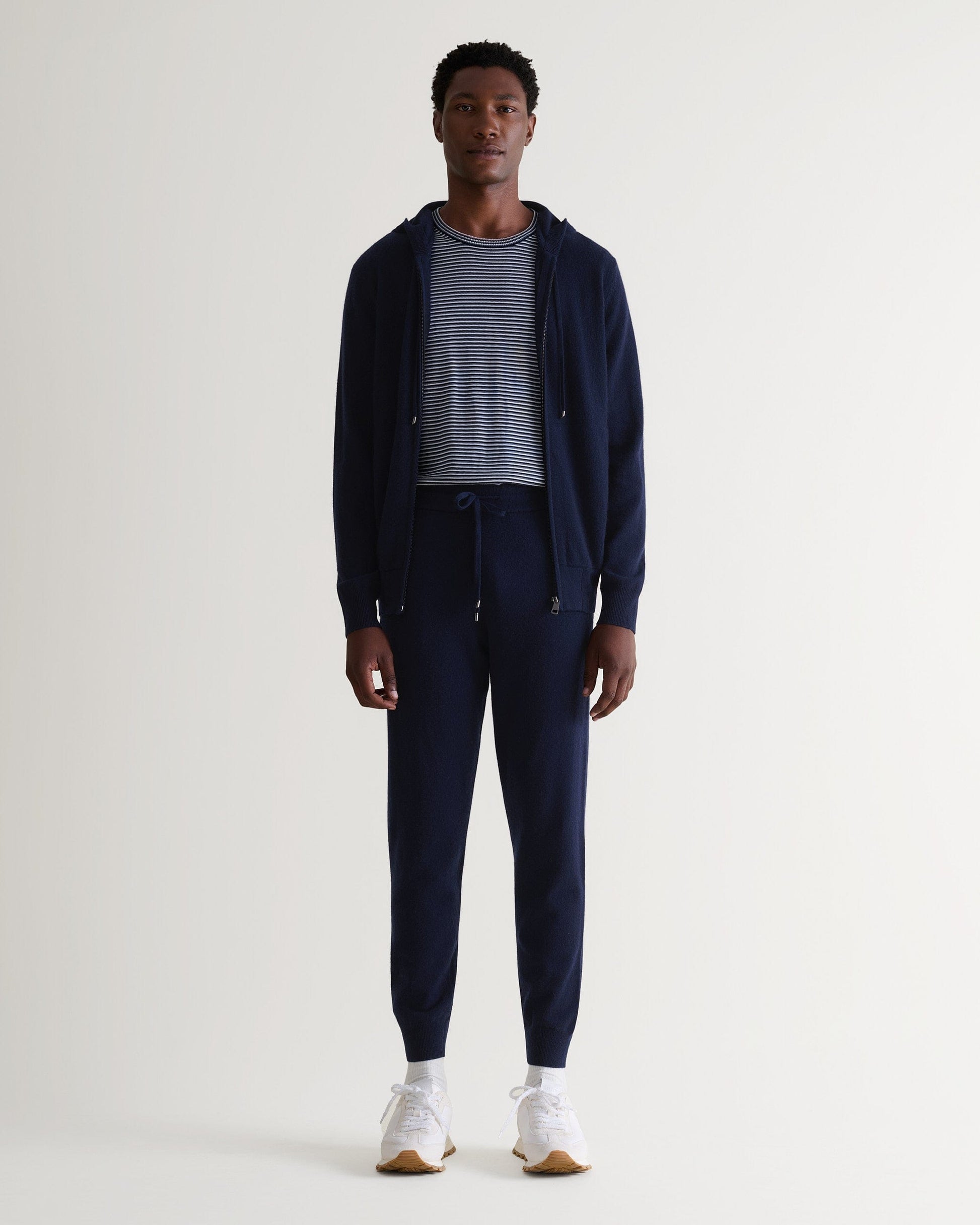 Image 1 of 5 showing man wearing Rise & Fall's fine cashmere zip hoodie, navy.