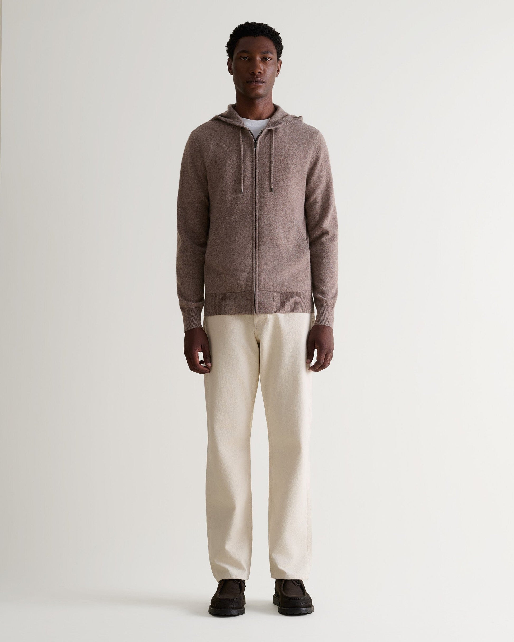 Image 1 of 5 showing man wearing Rise & Fall's fine cashmere zip hoodie, toast.