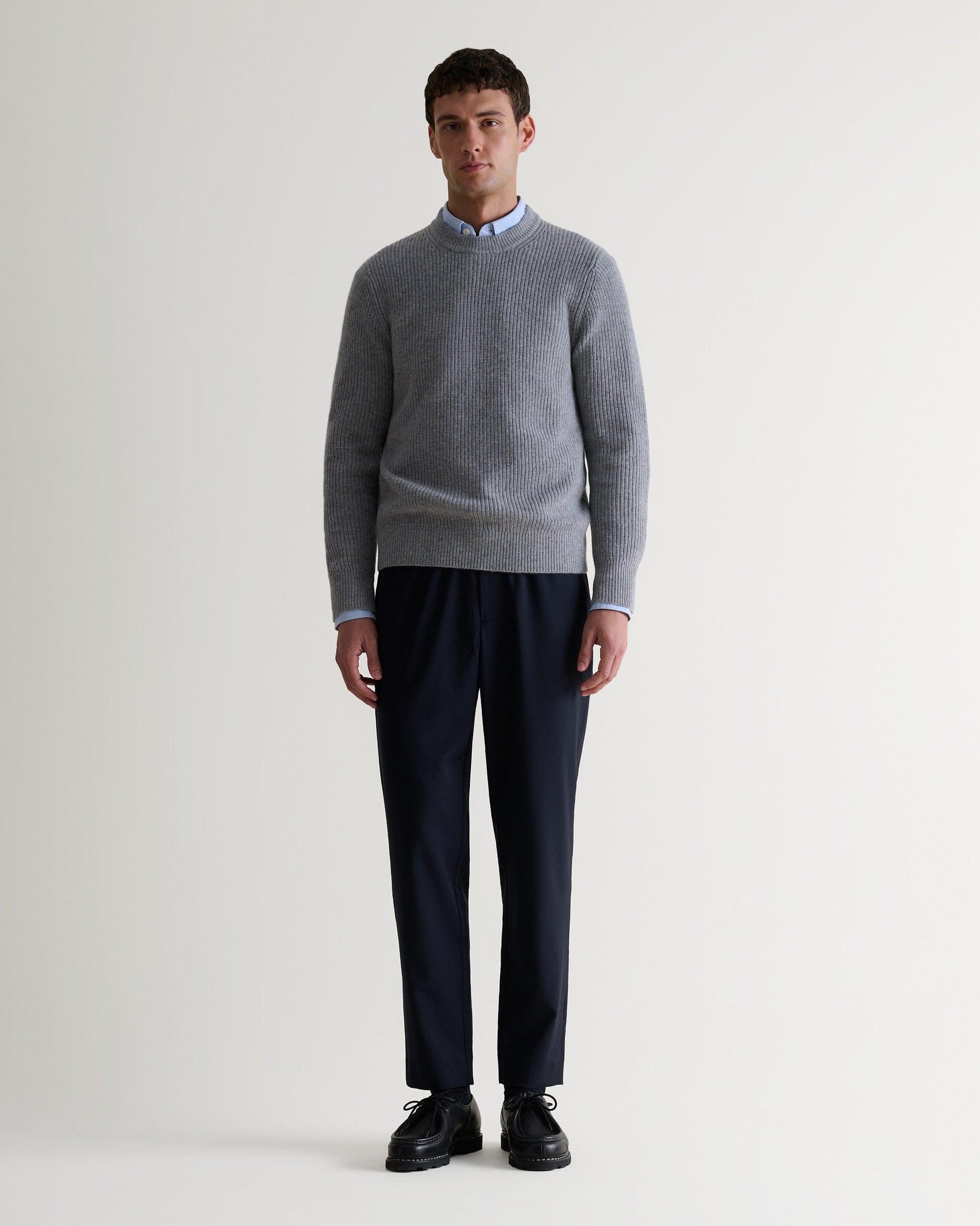Image 1 of 5 showing man wearing Rise & Fall's Cashmere Merino Fishermans Rib Crew Neck Jumper in grey.