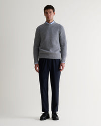Image 1 of 5 showing man wearing Rise & Fall's Cashmere Merino Fishermans Rib Crew Neck Jumper in grey.