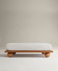 Image 1 of 5 showing Rise & Fall's Crisp & Cool organic percale cotton deep fitted bed sheet in buttermilk. 