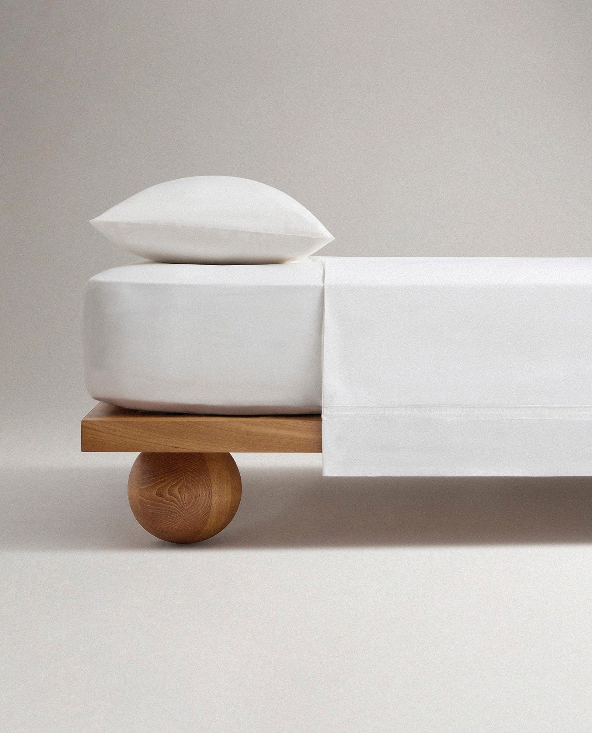 Image 1 of 5 showing Rise & Fall's Crisp & Cool organic percale cotton flat bed sheet in white tailored border.