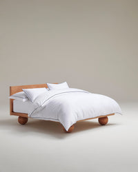 Image 1 of 5 showing Rise & Fall's percale cotton duvet cover, colour: white navy piping.