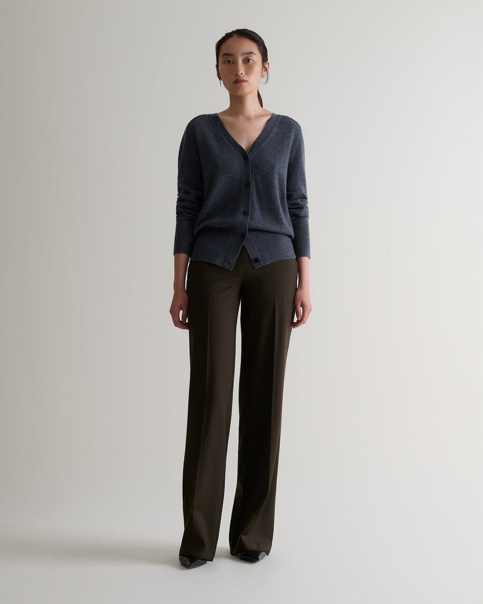 Image 1 of 5 showing woman wearing Rise & Fall's fine cashmere blouson cardigan, colour: graphite.