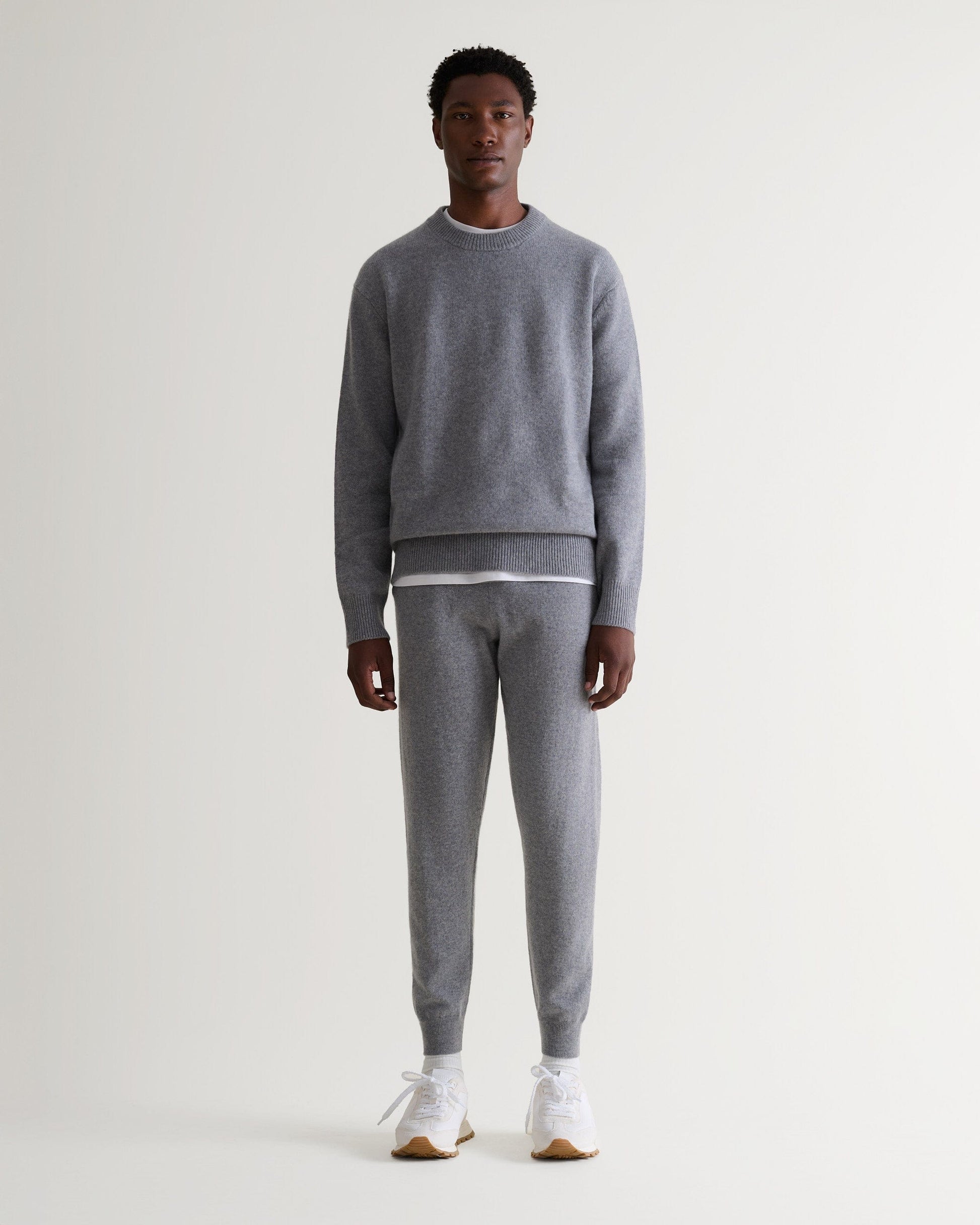 Image 1 of 6 showing man wearing Rise & Fall's fine cashmere joggers, grey.