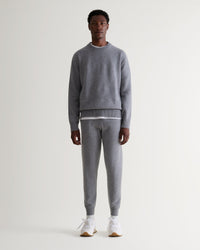 Image 1 of 6 showing man wearing Rise & Fall's fine cashmere joggers, grey.