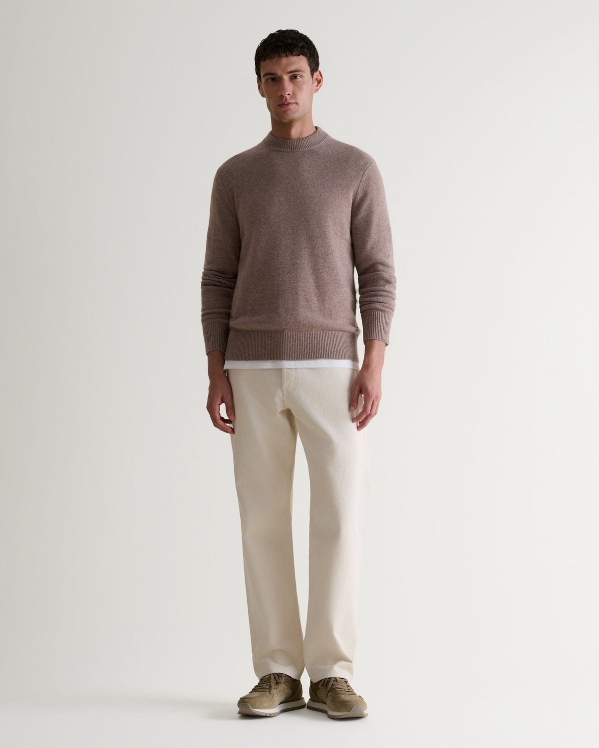 Image 1 of 6 showing man wearing Rise & Fall's Finest Cashmere Mid-Weight Crew Neck Jumper in toast brown.