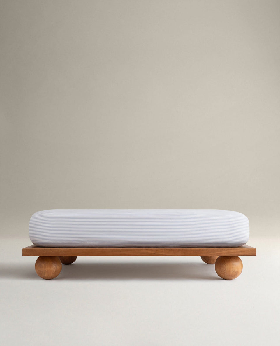 Image 1 of 6 showing Rise & Fall's Crisp & Cool organic cotton fitted sheet in blue stripe ticking.